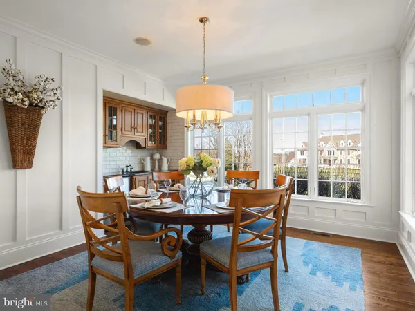 a bedroom with a bed chair and window