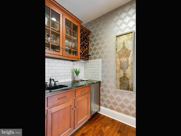 a bathroom with a sink toilet and mirror