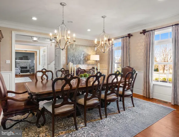 a bedroom with furniture and a wooden floor