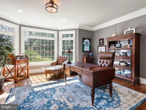 a bath tub sitting in a bathroom next to a window