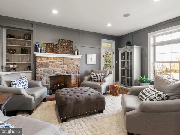 a bathroom with a granite countertop sink a toilet and a mirror