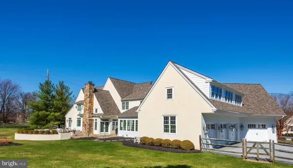 a bedroom with a bed couch and a window