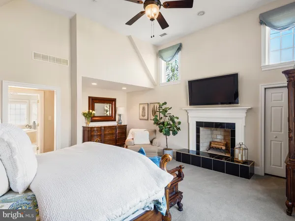 a spacious bedroom with a bed and a couch