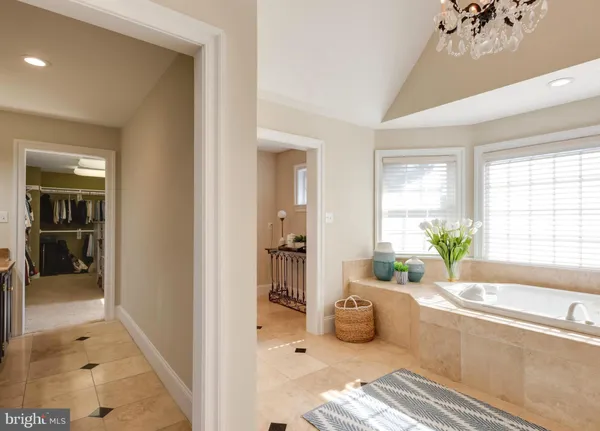 a view of empty room with wooden floor and a floor to ceiling window