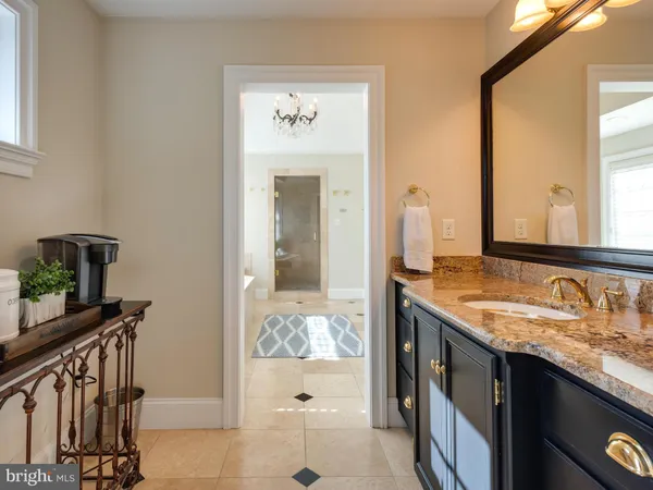 a living room with furniture floor to ceiling window and wooden floor
