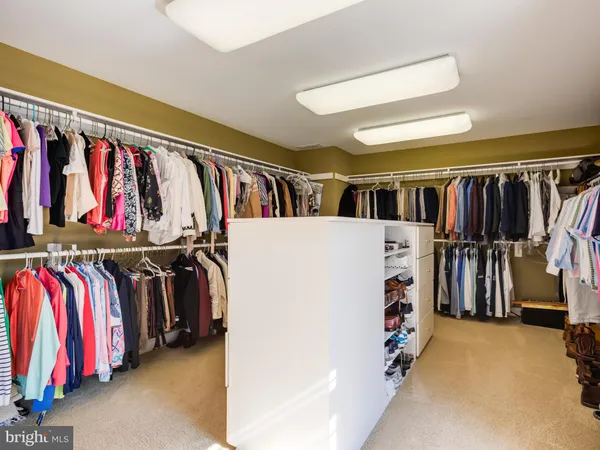 a view of house with garden and swimming pool