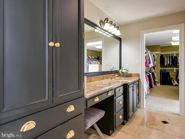 a view of a patio with table and chairs potted plants and a palm tree