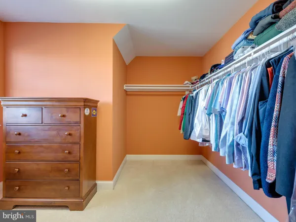 a front view of a house with a yard table and chairs