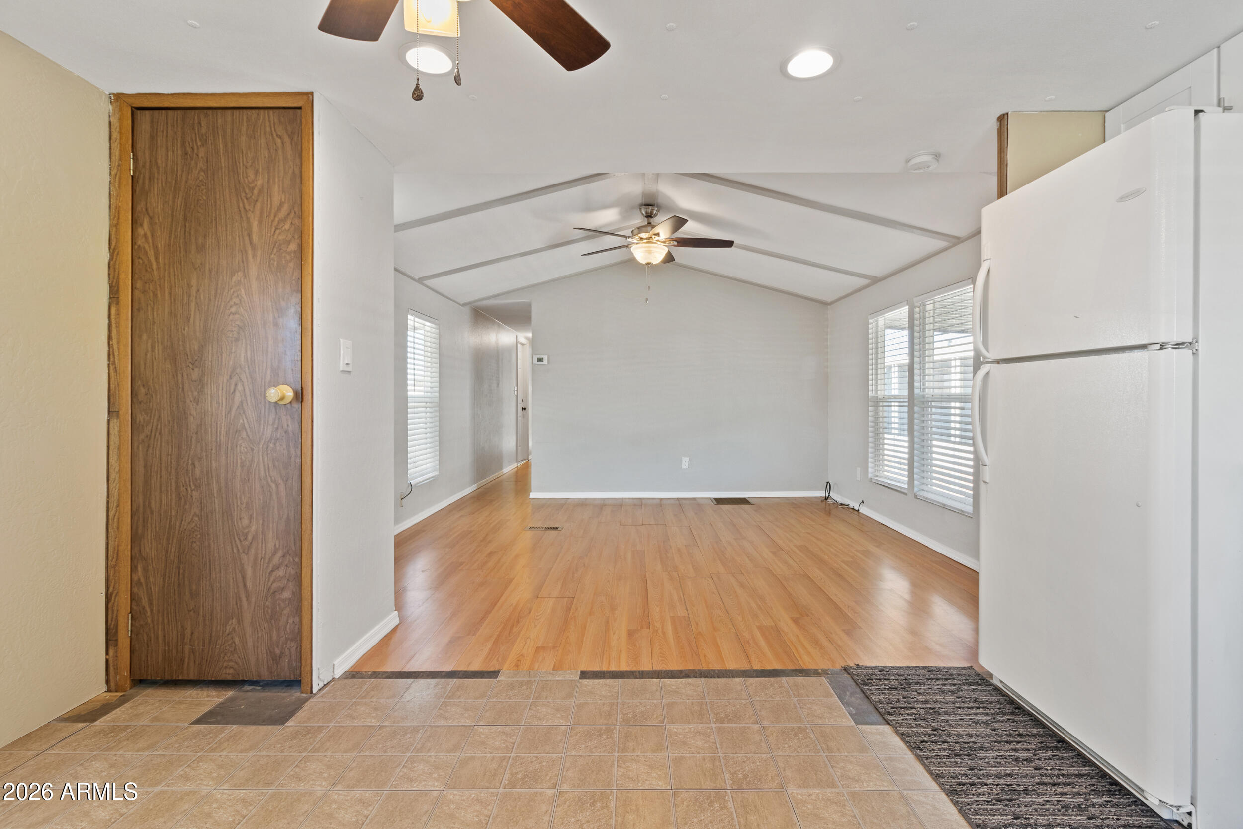 535 South Alma School Road, Unit 69 Mesa, AZ 85210 - Photo 12 of 59 a view of an empty room with a ceiling fan