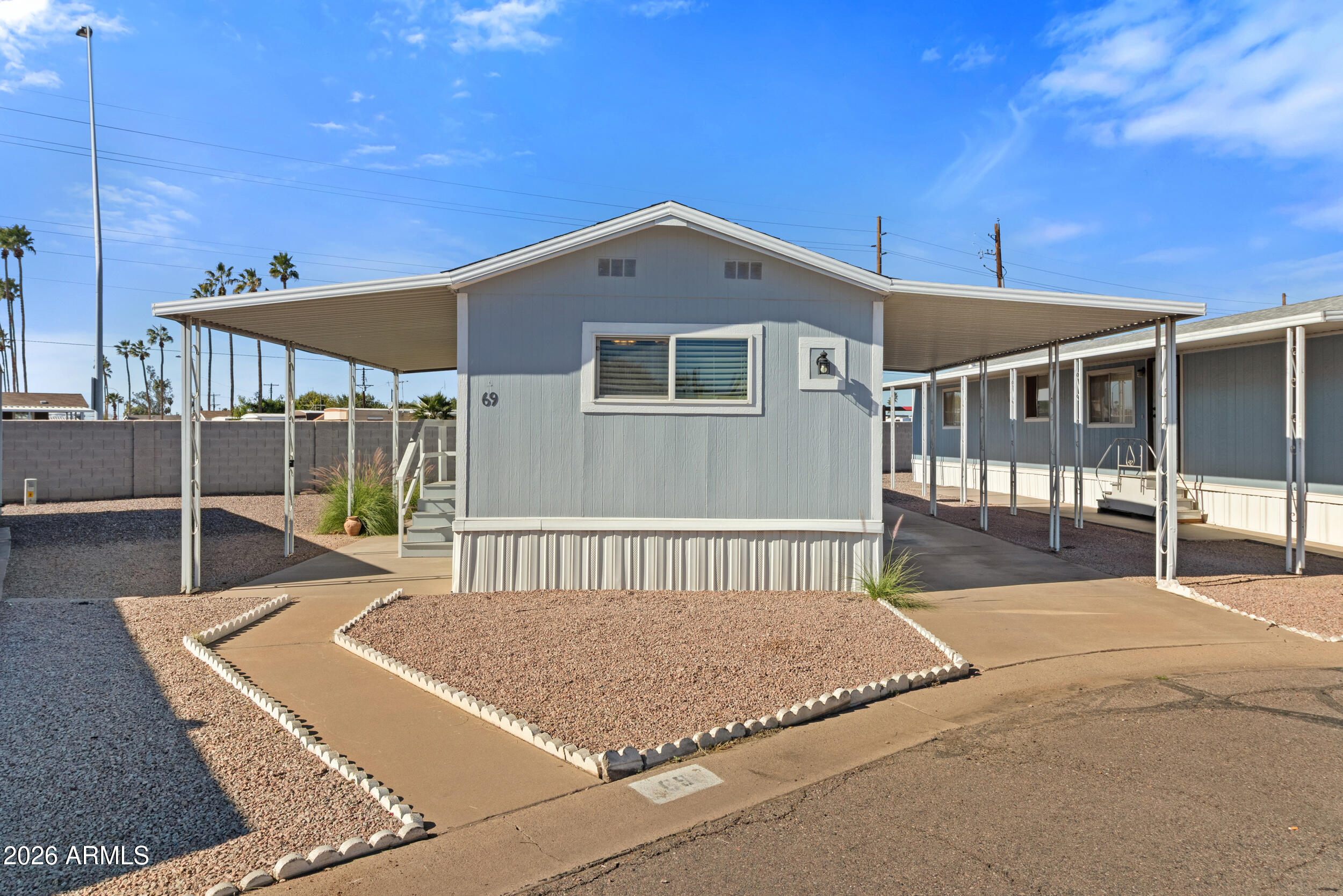535 South Alma School Road, Unit 69 Mesa, AZ 85210 - Photo 25 of 59 a view of a house with backyard and porch