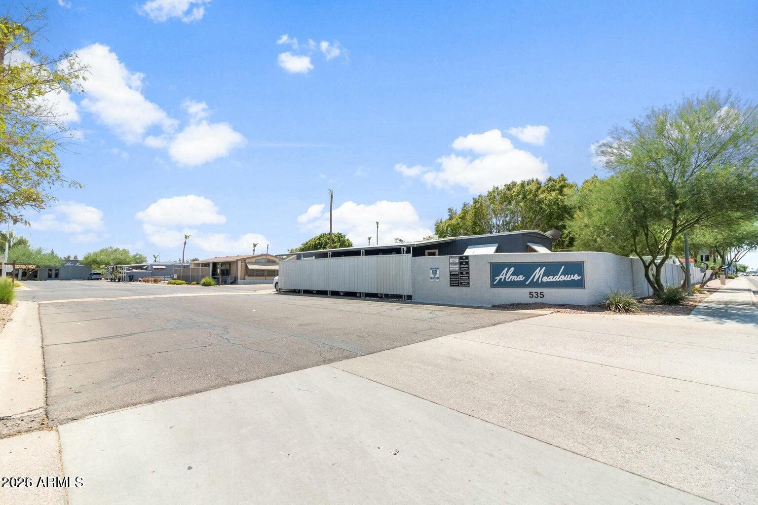 535 South Alma School Road, Unit 69 Mesa, AZ 85210 - Photo 26 of 59 a front view of a house with a yard and garage