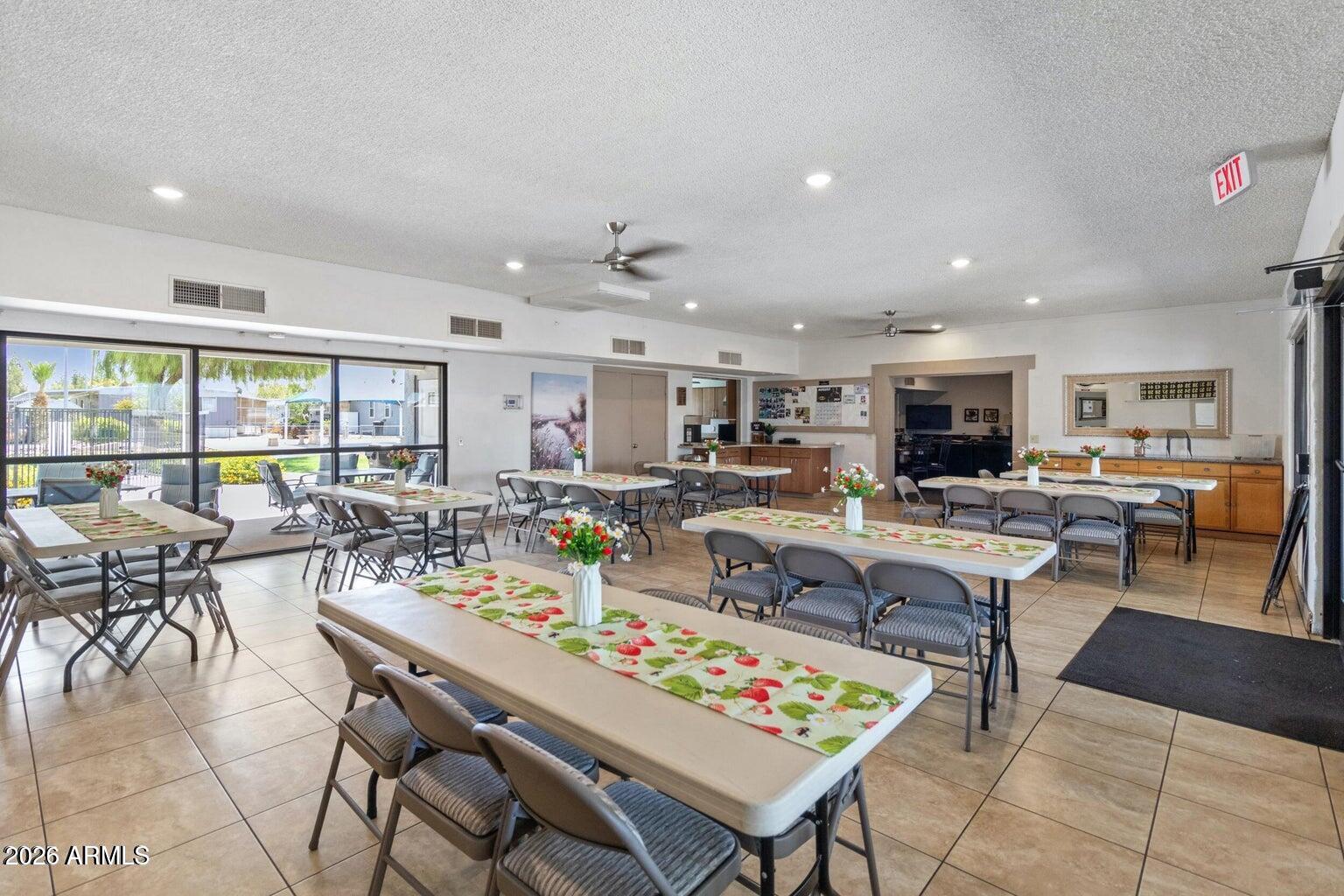 535 South Alma School Road, Unit 69 Mesa, AZ 85210 - Photo 28 of 59 a living room with lots of furniture and a table