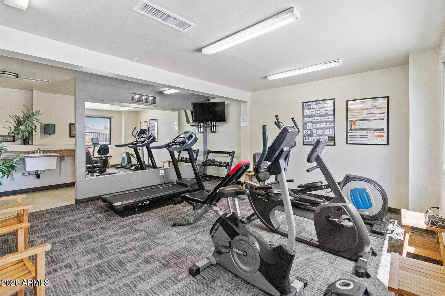 535 South Alma School Road, Unit 69 Mesa, AZ 85210 - Photo 36 of 59 a view of a room with gym equipment