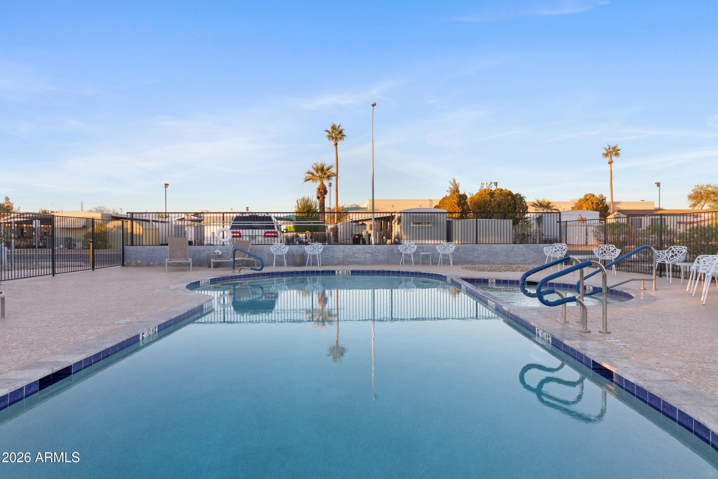 535 South Alma School Road, Unit 69 Mesa, AZ 85210 - Photo 42 of 59 a view of a swimming pool with outdoor seating