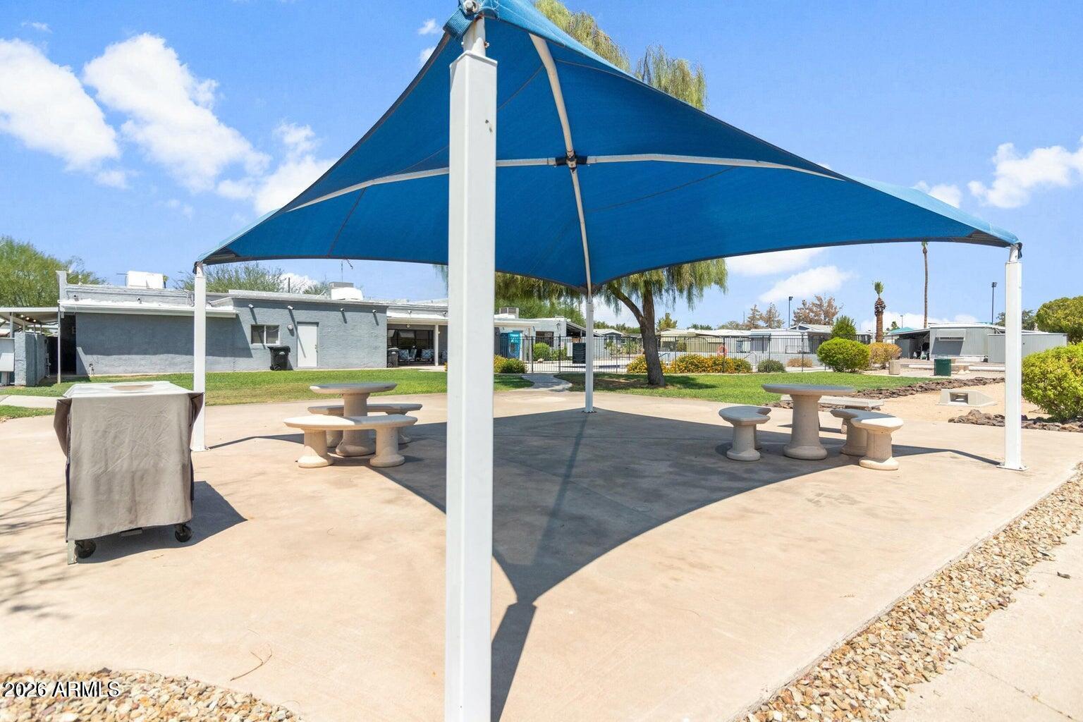 535 South Alma School Road, Unit 69 Mesa, AZ 85210 - Photo 45 of 59 a view of a swimming pool with outdoor seating