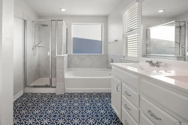 a bathroom with a bathtub and a sink
