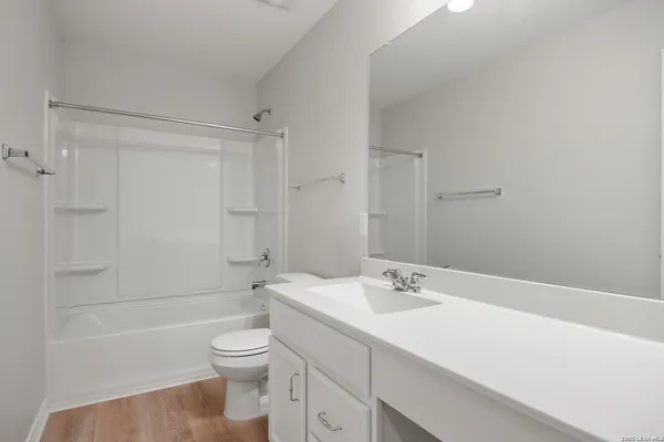 a bathroom with a sink a toilet and a bathtub