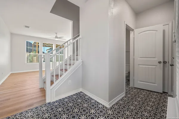 a view of entryway with stairs and wooden floor