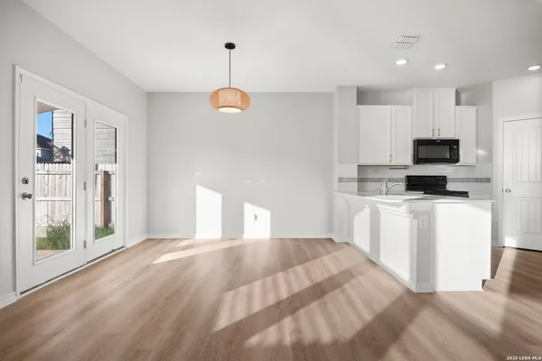 a bedroom with a bed and a television