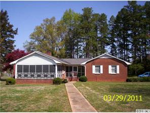4710 Beatties Ford Road Charlotte, NC 28216 - Photo 2 of 6 a front view of a house with garden