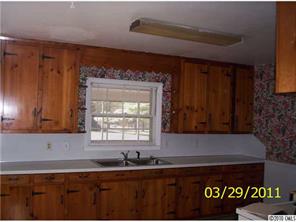 4710 Beatties Ford Road Charlotte, NC 28216 - Photo 6 of 6 a kitchen with a sink and cabinets