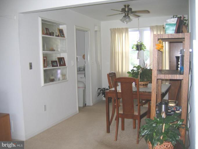 12712 Feldon Street Silver Spring, MD 20906 - Photo 3 of 12 a view of a dining room with furniture and a window