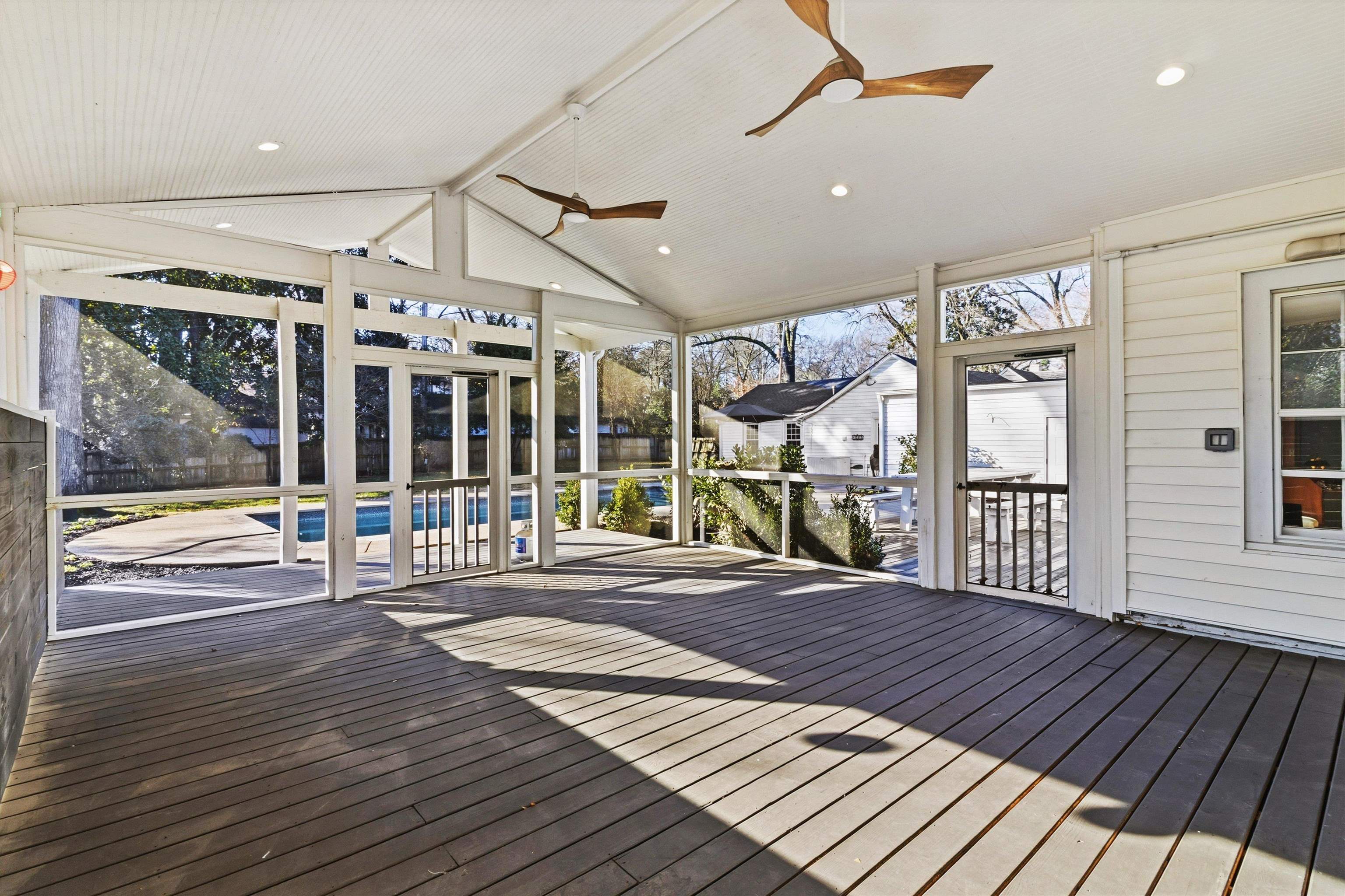 4009 Walnut Grove Road Memphis, TN 38117 - Photo 20 of 38 Unfurnished sunroom featuring a deck, lofted ceiling, and ceiling fan