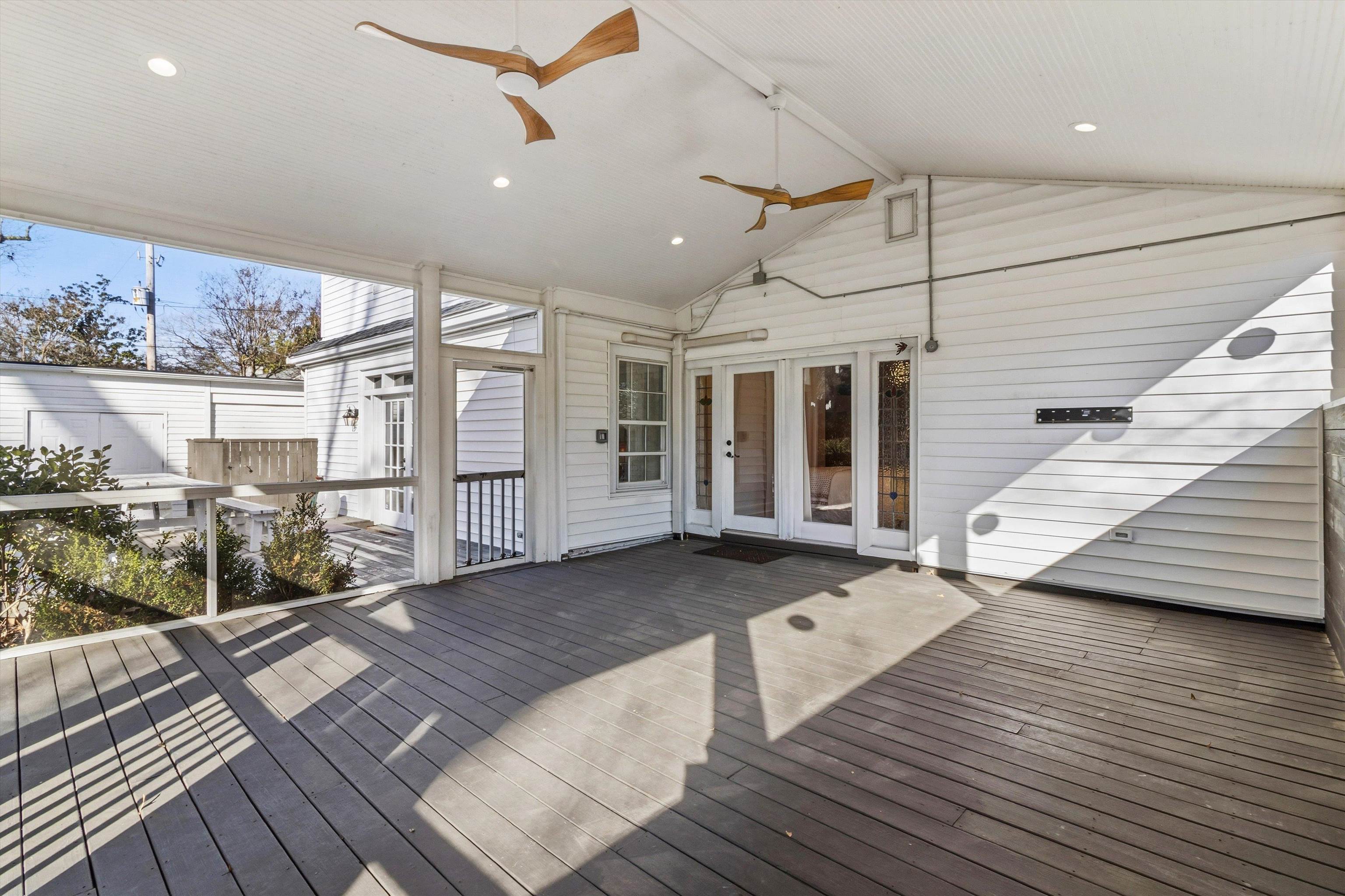 4009 Walnut Grove Road Memphis, TN 38117 - Photo 21 of 38 Wooden terrace with ceiling fan, a sunroom, and french doors