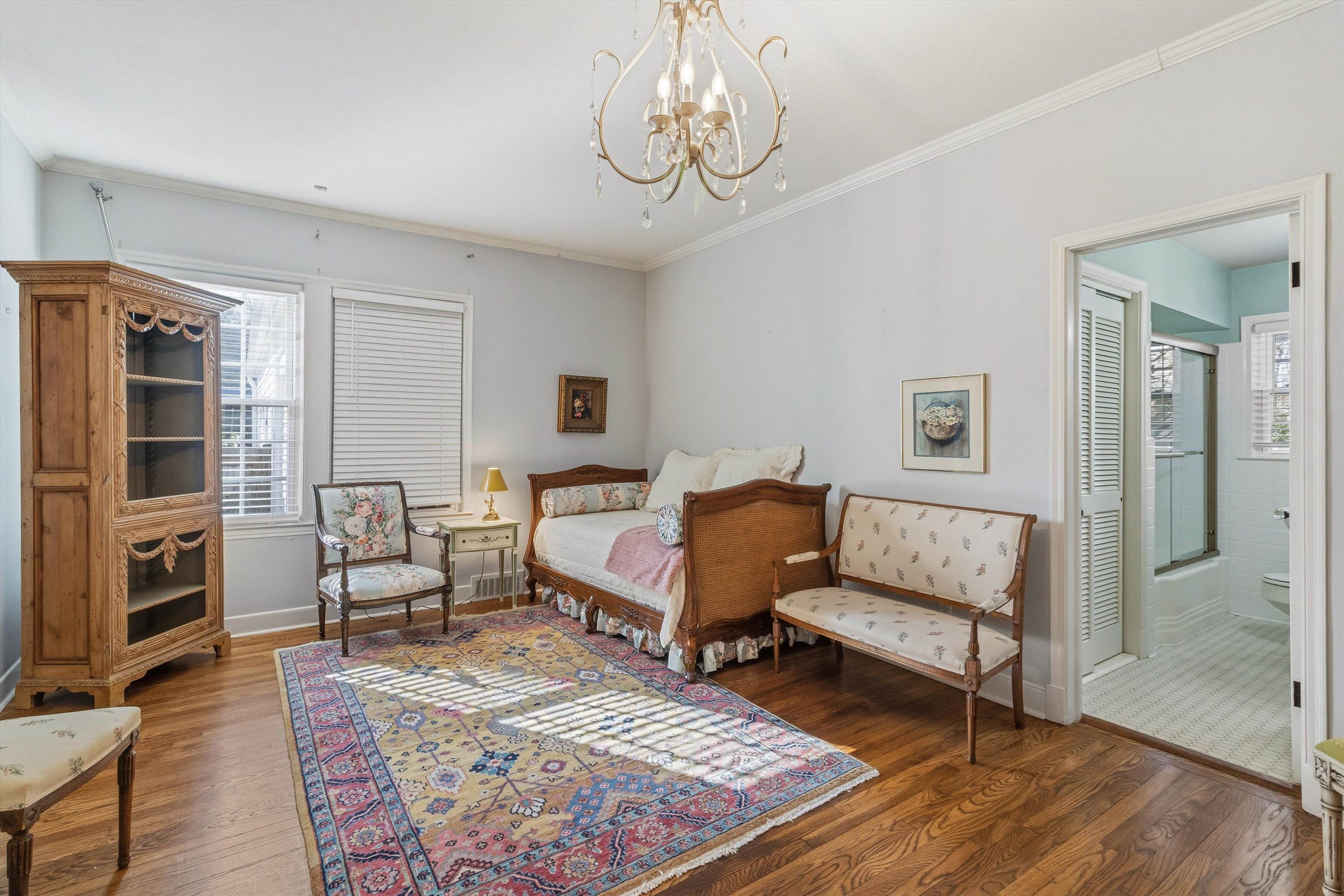 4009 Walnut Grove Road Memphis, TN 38117 - Photo 22 of 38 Bedroom with dark wood-type flooring, ornamental molding, and a chandelier