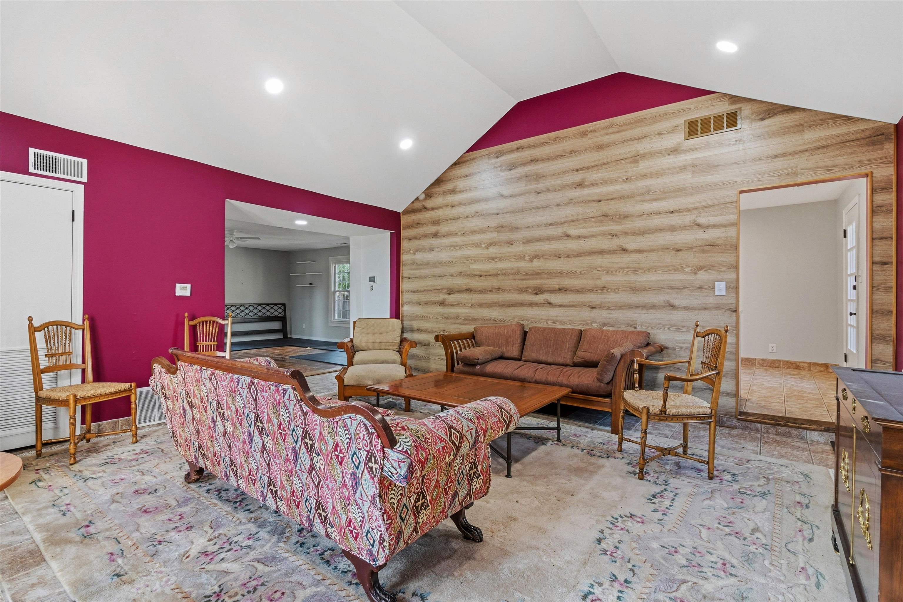 4009 Walnut Grove Road Memphis, TN 38117 - Photo 34 of 38 Living area featuring an accent wall, lofted ceiling, recessed lighting, and wooden walls