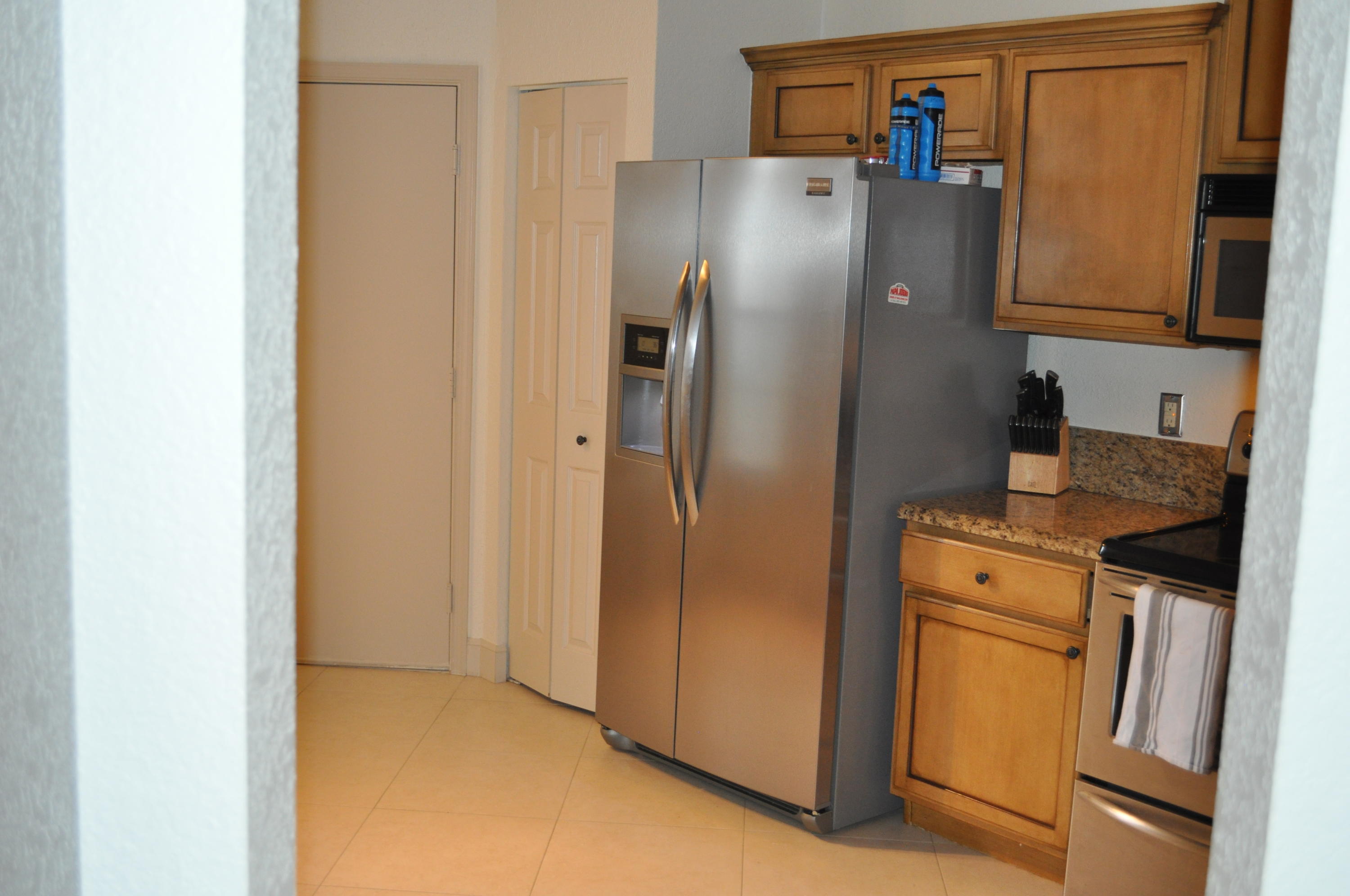 8321 Via Leonessa Boca Raton, FL 33433 - Photo 22 of 26 Kitchen to garage