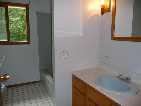 223 Three Rivers Road Wilbraham, MA 01095 - Photo 14 of 19 a bathroom with a sink and a mirror