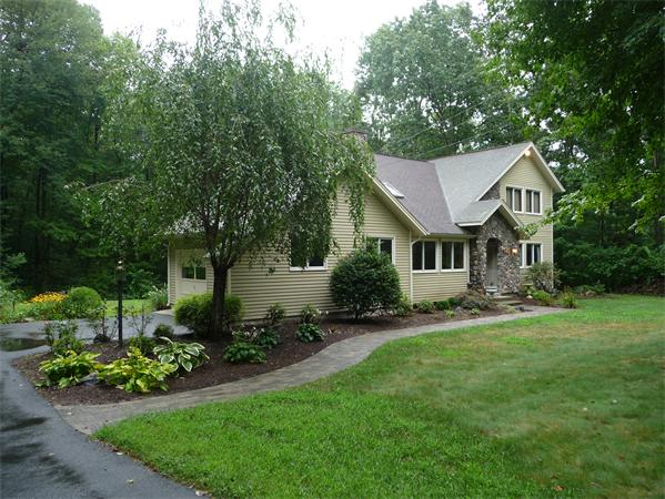 223 Three Rivers Road Wilbraham, MA 01095 - Photo 19 of 19 a front view of a house with a yard and trees