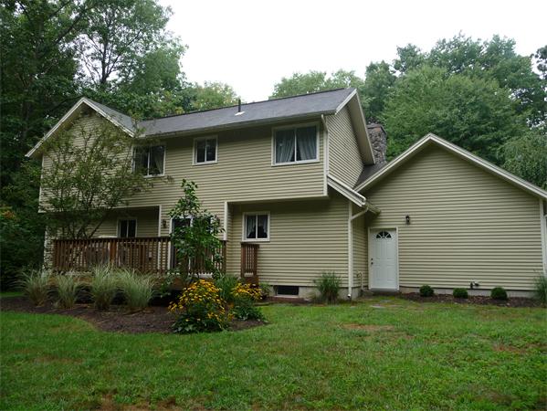223 Three Rivers Road Wilbraham, MA 01095 - Photo 2 of 19 a front view of house with yard and green space