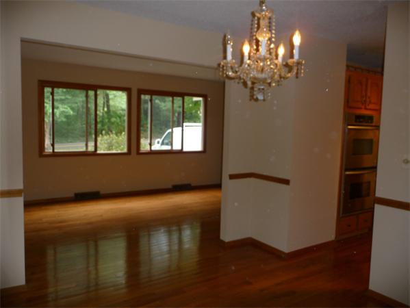 223 Three Rivers Road Wilbraham, MA 01095 - Photo 6 of 19 a view of empty room with wooden floor and fan
