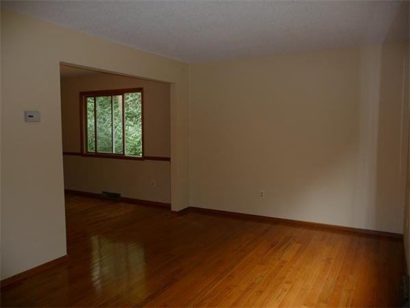 223 Three Rivers Road Wilbraham, MA 01095 - Photo 9 of 19 an empty room with wooden floor and windows