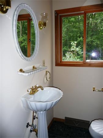 223 Three Rivers Road Wilbraham, MA 01095 - Photo 10 of 19 a bathroom with a sink and a mirror