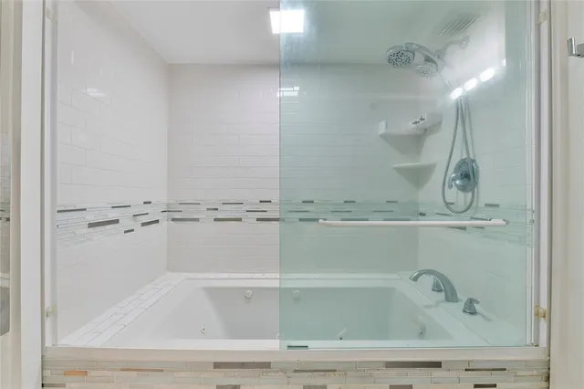 a view of a bathroom with a bathtub