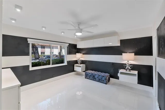 a living room with couches and large flat screen tv