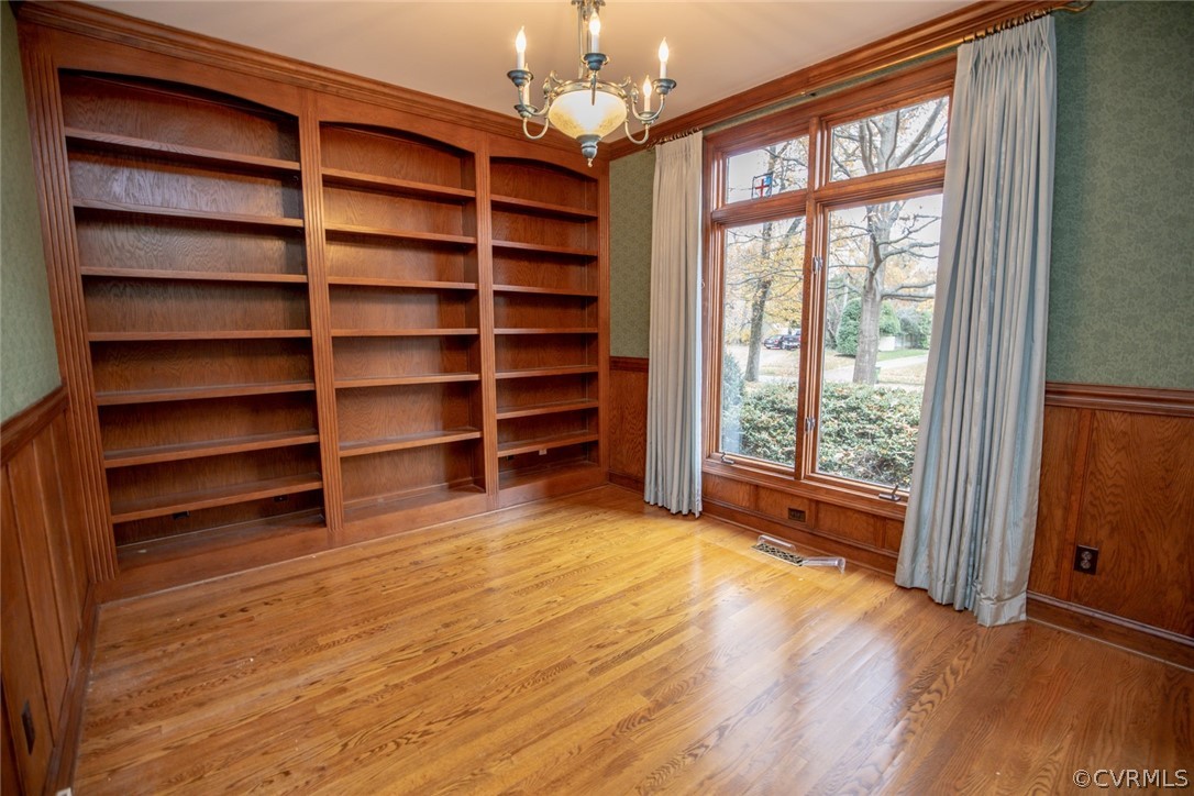 110 Penshurst Road Richmond, VA 23221 - Photo 9 of 39 Oak built-in bookcases and trim accent the library