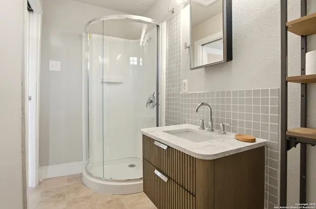 a bathroom with a sink and a mirror