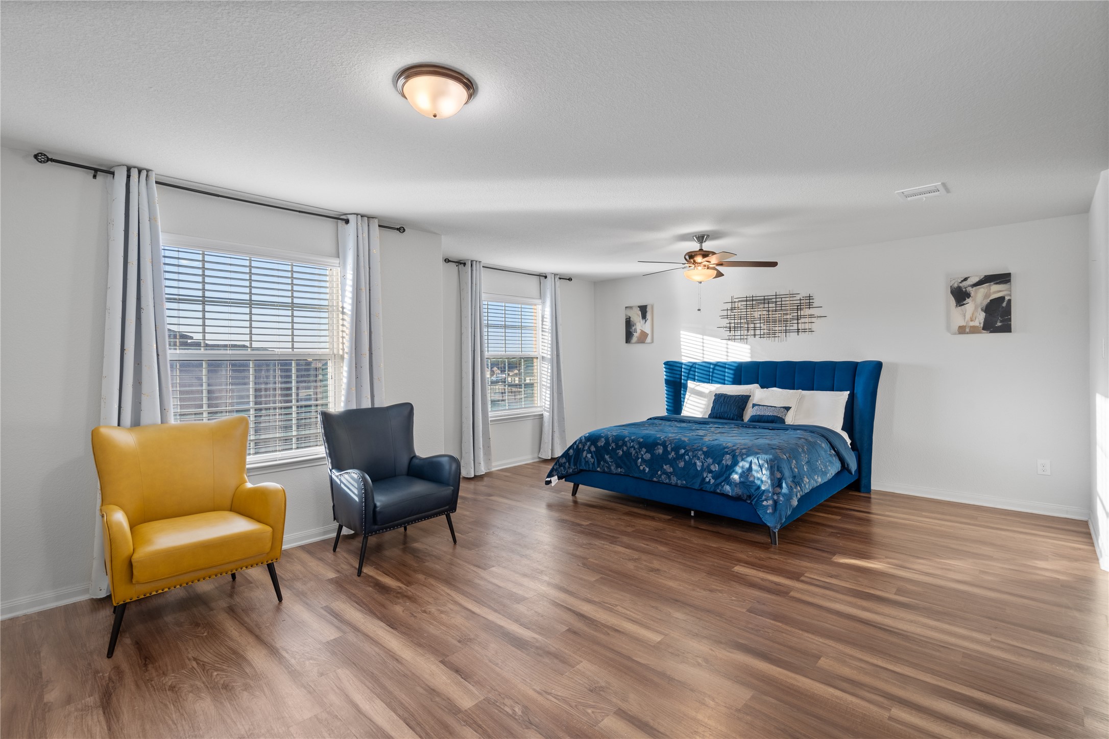 20205 Grover Cleveland Way Manor, TX 78653 - Photo 16 of 26 a bedroom with a bed and a couch