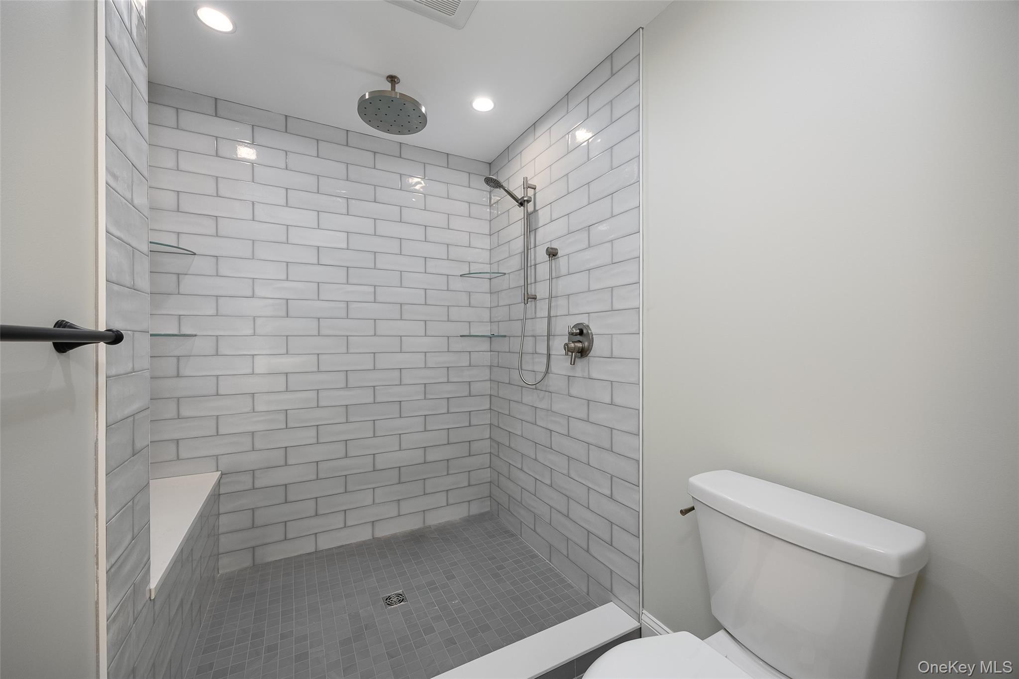 15 Henry Street, Unit 2 Beacon, NY 12508 - Photo 16 of 25 a bathroom with a shower and toilet