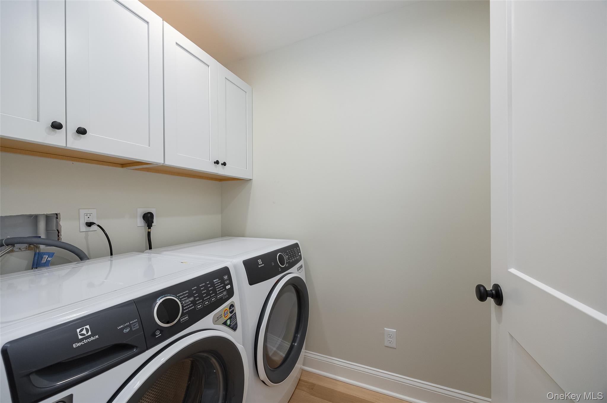 15 Henry Street, Unit 2 Beacon, NY 12508 - Photo 21 of 25 a utility room with dryer and washer