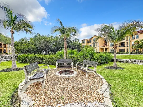 a view of a house with garden and a patio