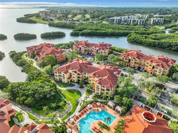 an aerial view of lake residential house with outdoor space and seating