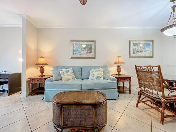 a living room with furniture and a table