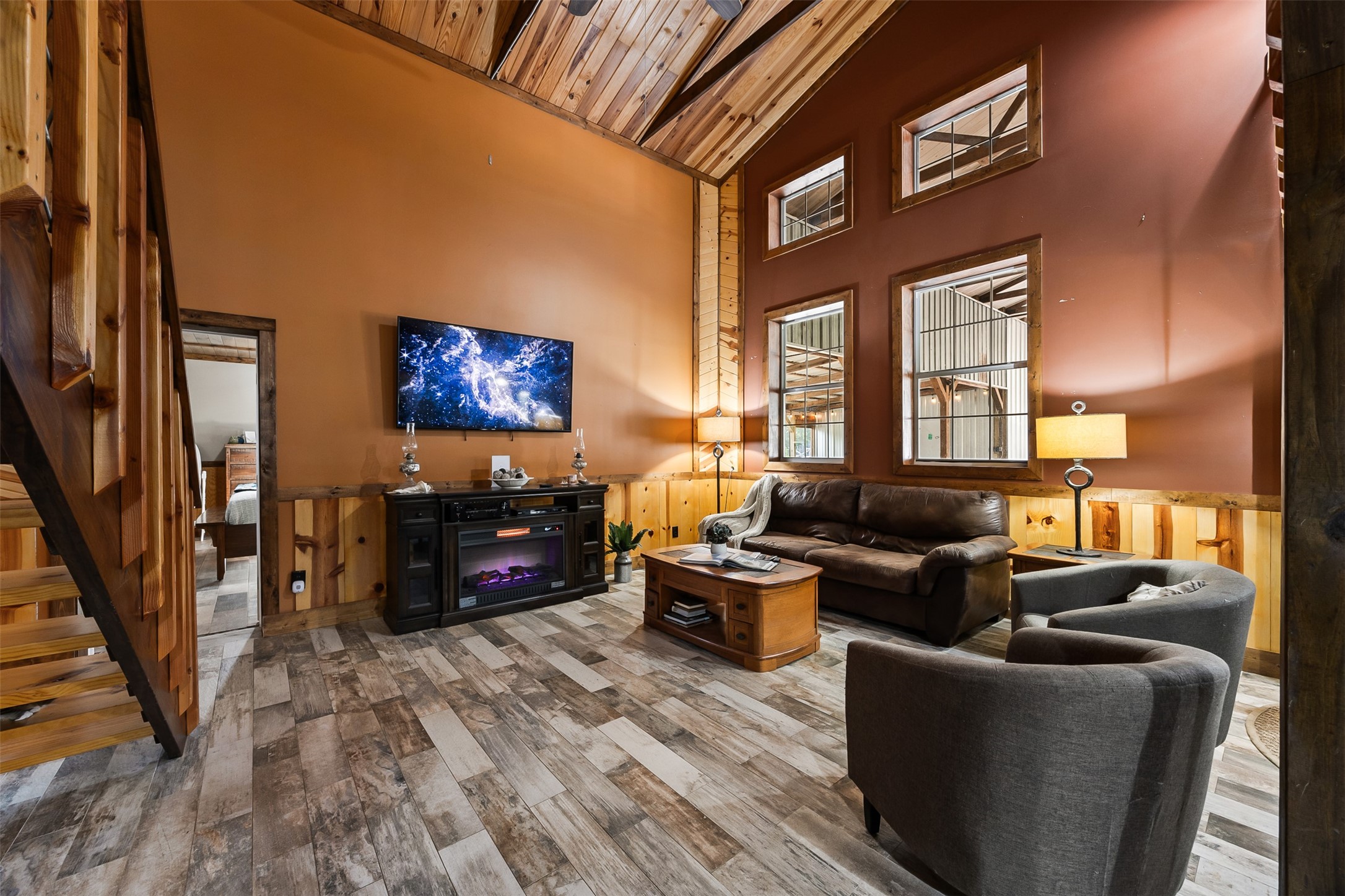 40 Olson Road New Waverly, TX 77358 - Photo 12 of 34 a living room with furniture flat screen tv and a fireplace