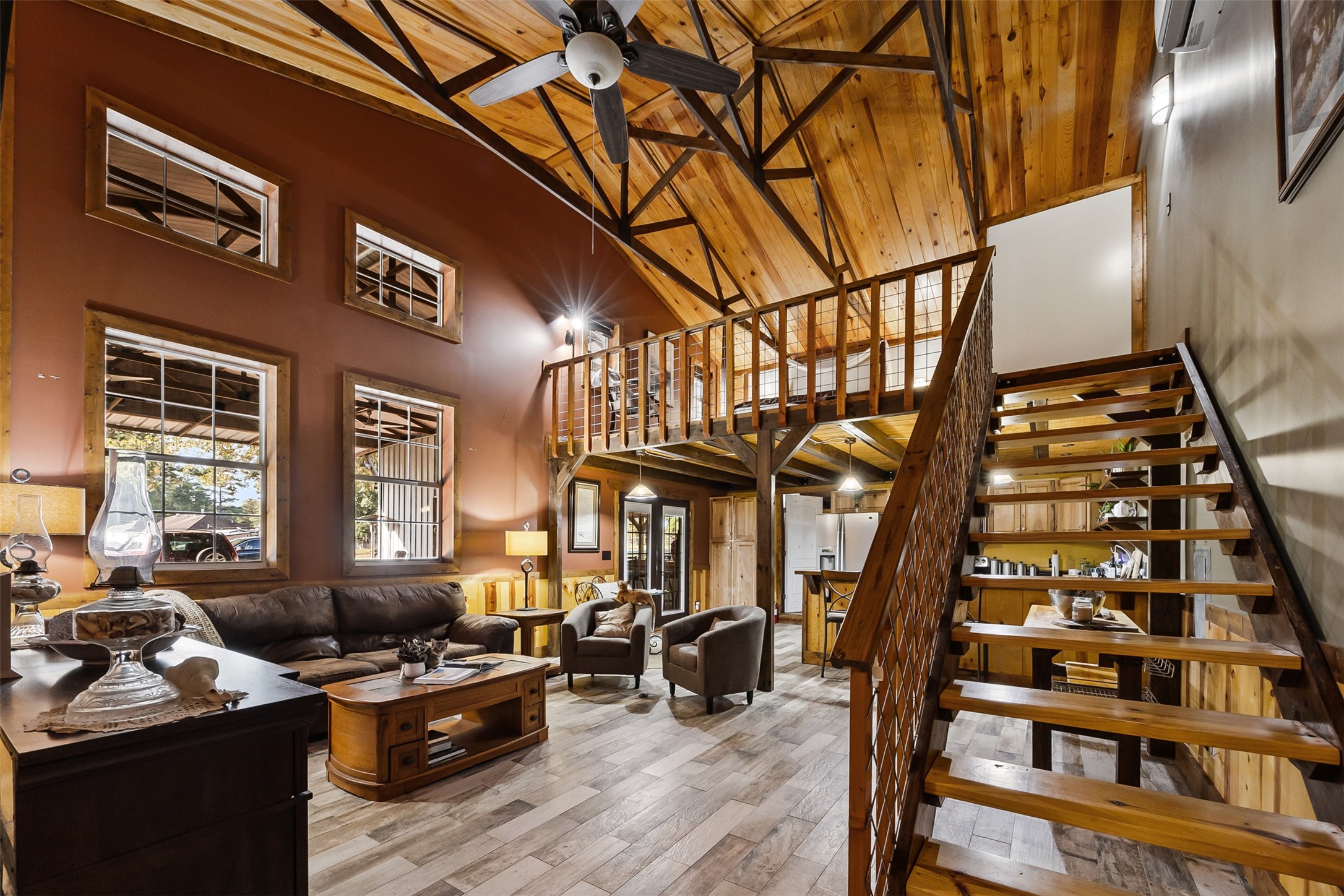 40 Olson Road New Waverly, TX 77358 - Photo 20 of 34 a living room with furniture and floor to ceiling windows