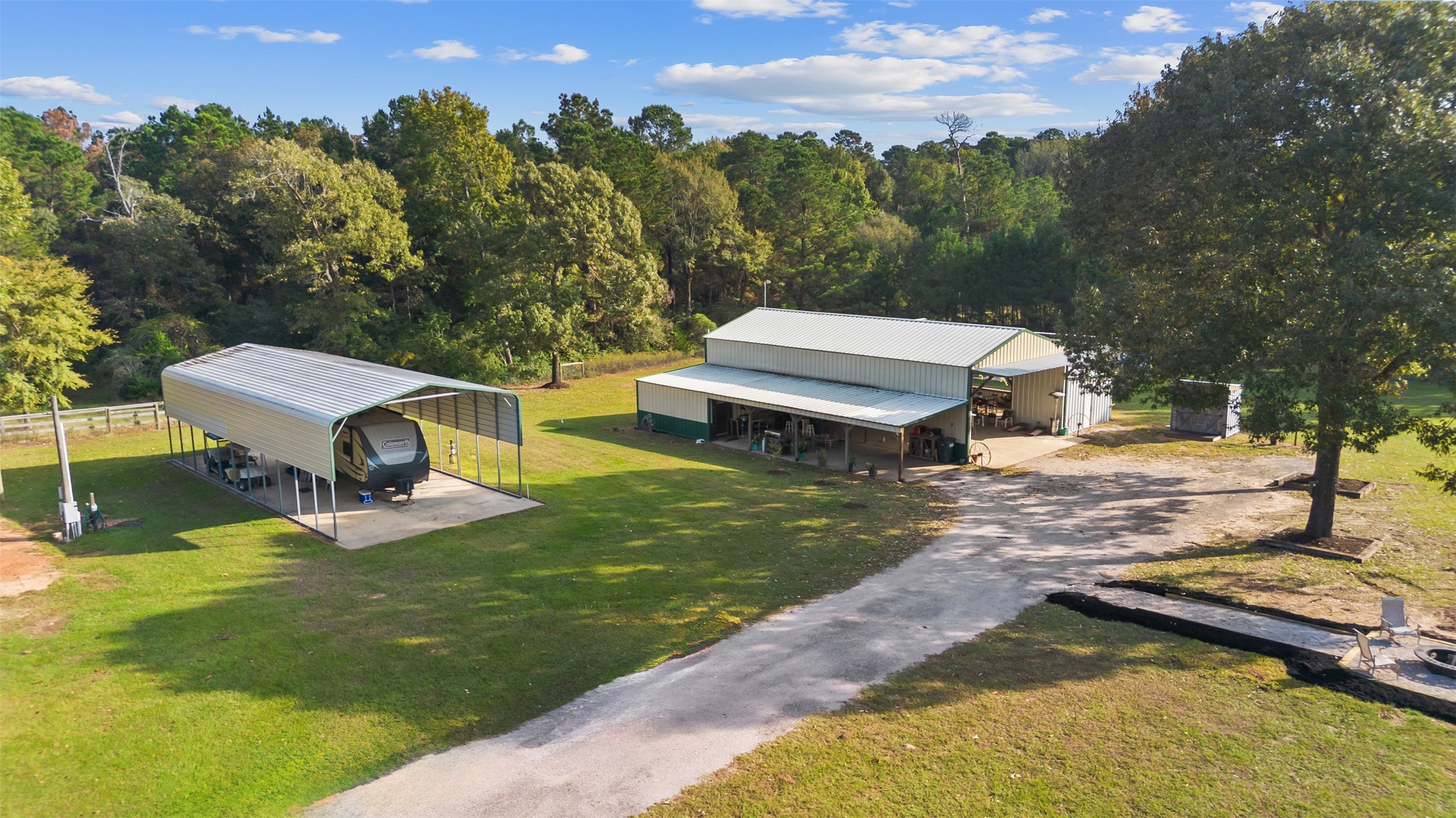40 Olson Road New Waverly, TX 77358 - Photo 2 of 34 an aerial view of a house with swimming pool garden and trees